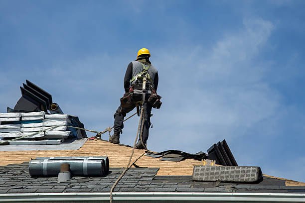 Professional Roof Replacement technician working in Dearborn, MO
